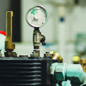 Mechanical HVAC equipment and pressure monitoring gauge for commercial heating and cooling systems.